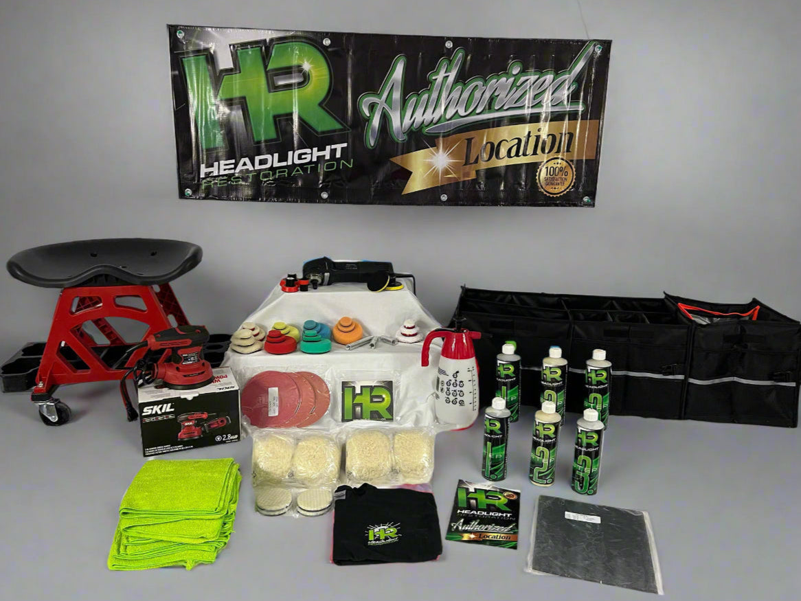 Collection of automotive care products and tools on a table with a 'HR' branded banner above.