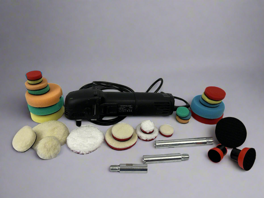Polishing tool set with various attachments on a gray background
